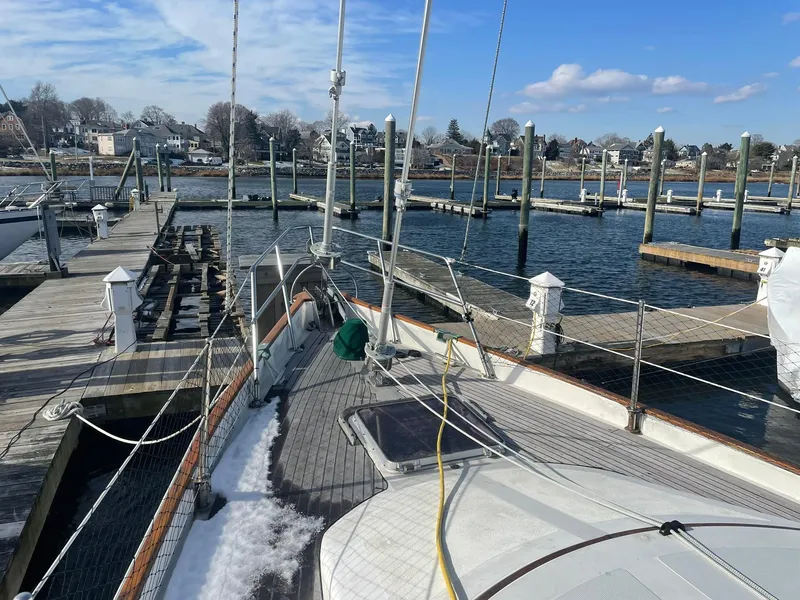 Slide: The Image of Sailboat docked at marina, clear sky, Passport 51 model, 1987. - 13