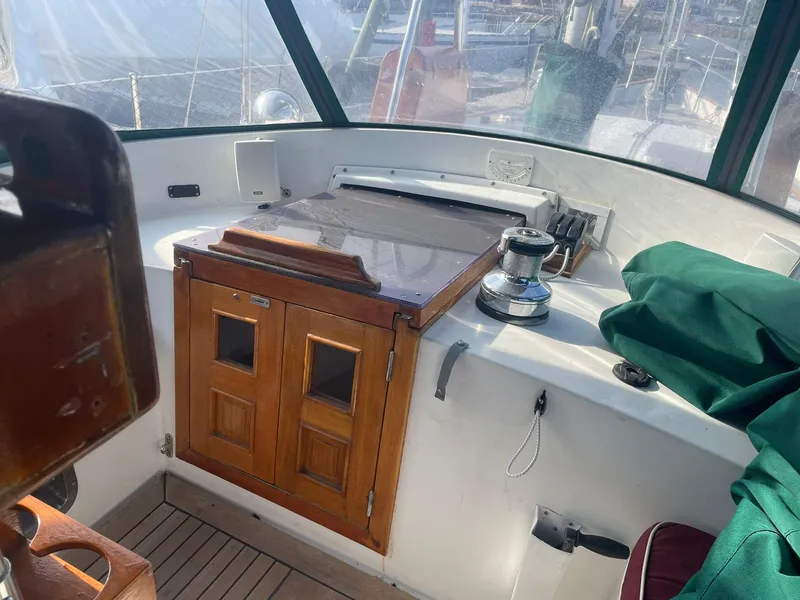 Slide: The Image of Cockpit of 1987 Passport 51 sailboat with wooden hatch and winch. - 15