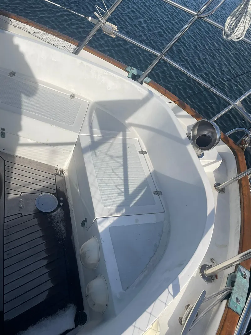 Slide: The Image of Cockpit of 1987 Passport 51 sailboat with wooden trim and ocean view. - 28