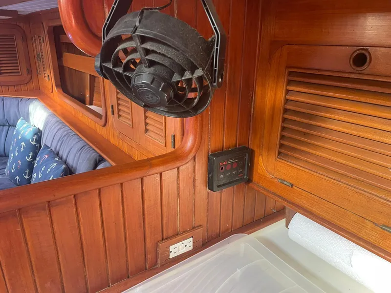 Slide: The Image of Interior of 1987 Passport 51 yacht with wooden paneling and fan. - 55
