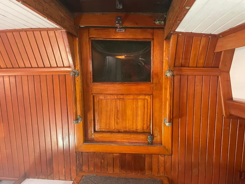Slide: The Image of Wooden cabin interior with a door, Passport 51, 1987 model. - 66