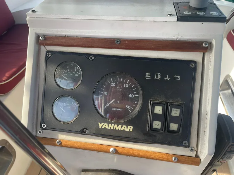 Slide: The Image of Control panel of a 1987 Passport 51 boat with Yanmar gauges and switches. - 7