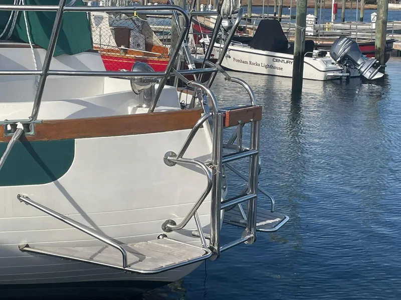 Slide: The Image of Sailboat stern with ladder in marina, Passport 51, 1987 model. - 8