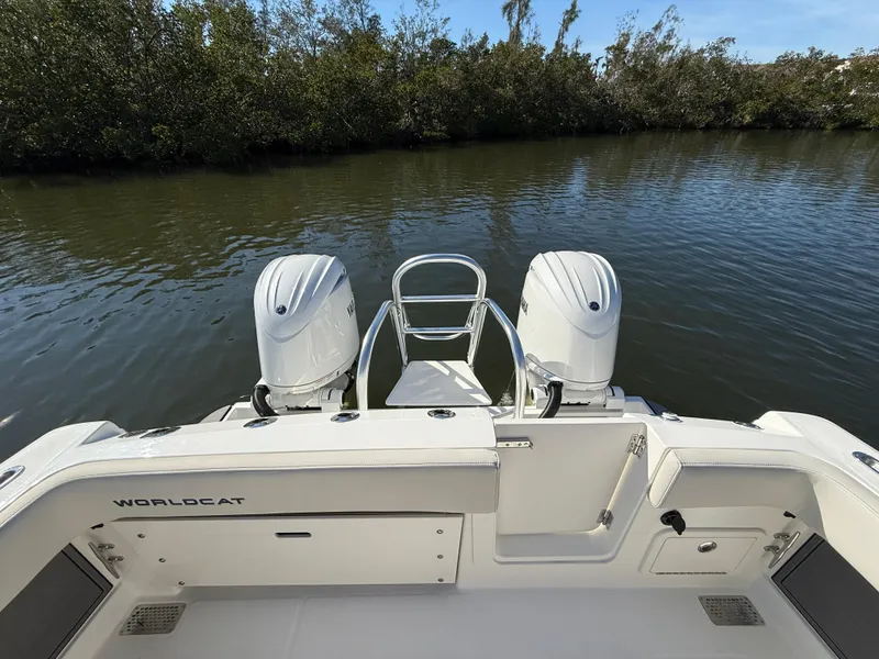 Slide: The Image of 2025 World Cat 280 CC-X boat with dual engines on a calm river. - 6