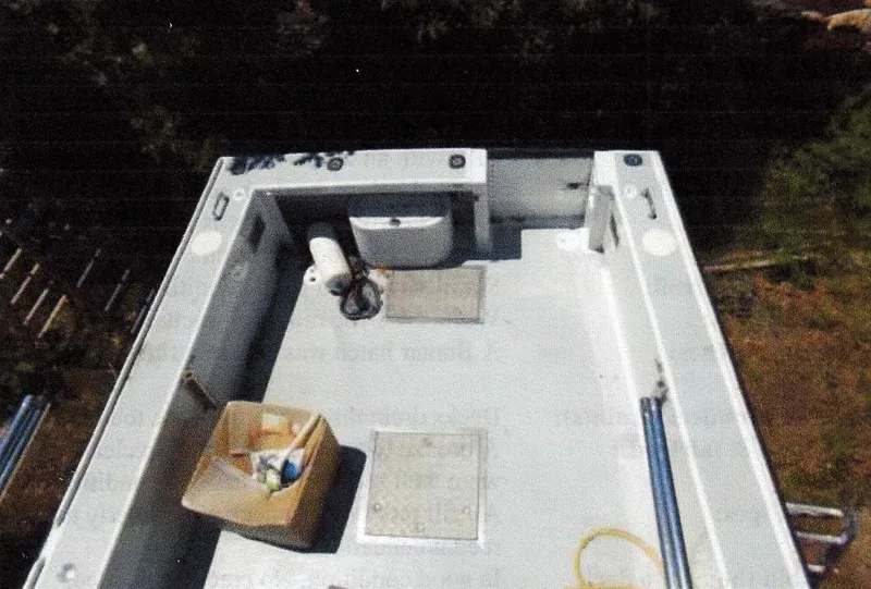 Slide: The Image of 1999 Custom 30 Novi Hardtop Cruiser deck with storage and equipment. - 11