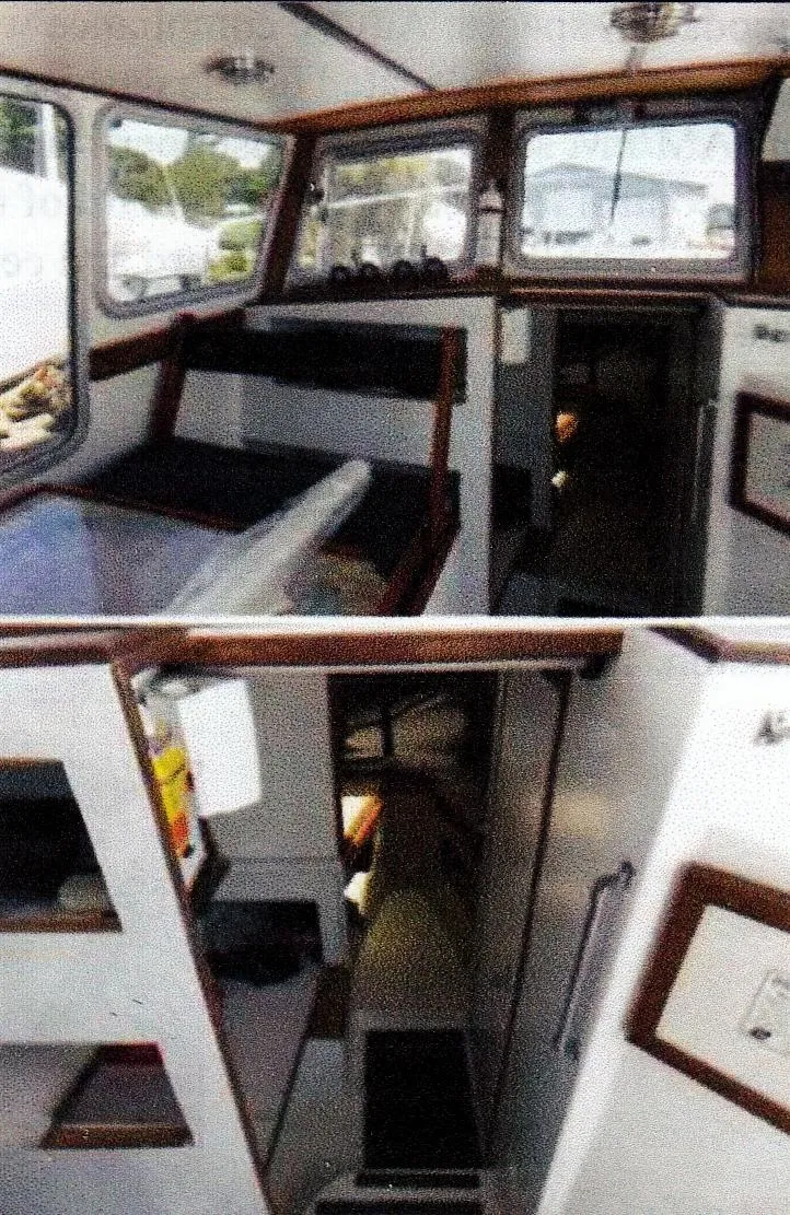 Slide: The Image of 1999 Custom 30 Novi Hardtop Cruiser interior with seating and navigation area. - 2