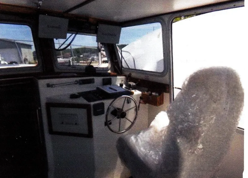 Slide: The Image of Interior of 1999 Custom 30 Novi Hardtop Cruiser with steering wheel and wrapped seat. - 3