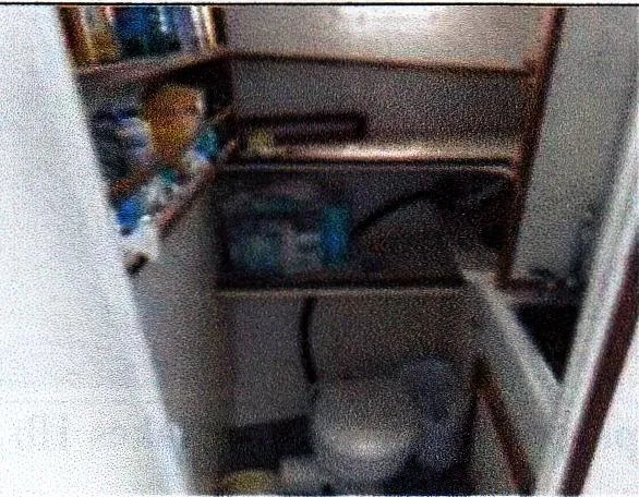 Slide: The Image of Small bathroom with shelves in a 1999 Custom 30 Novi Hardtop Cruiser. - 5