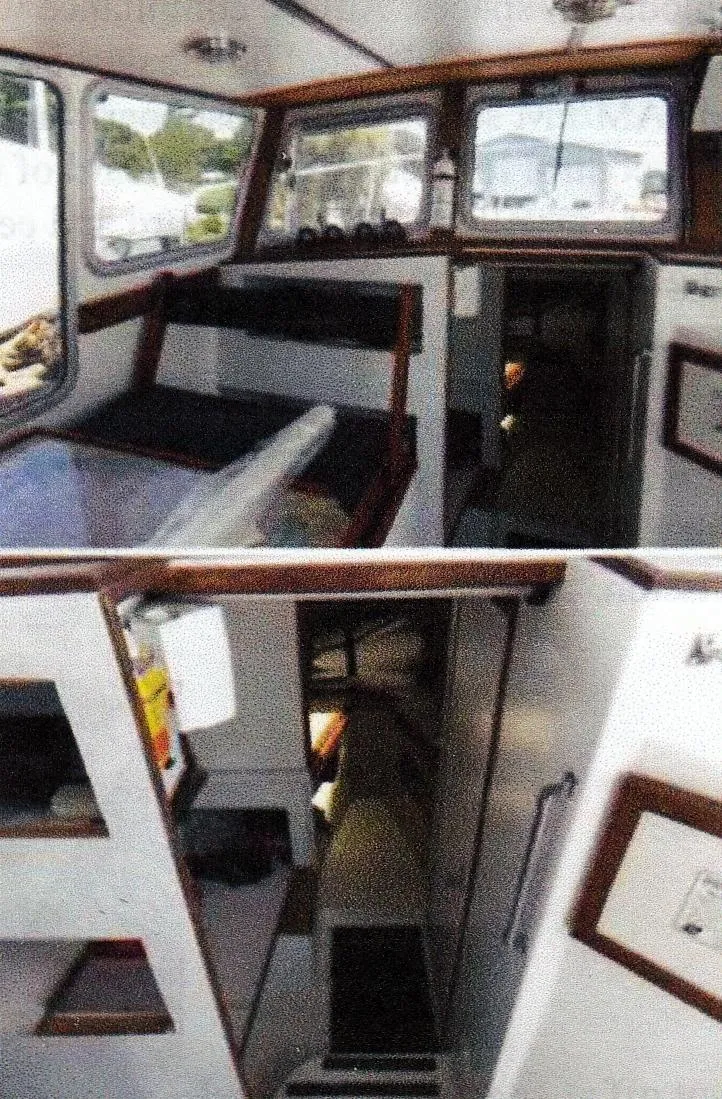 Slide: The Image of Interior of 1999 Custom 30 Novi Hardtop Cruiser with wood accents and seating area. - 6