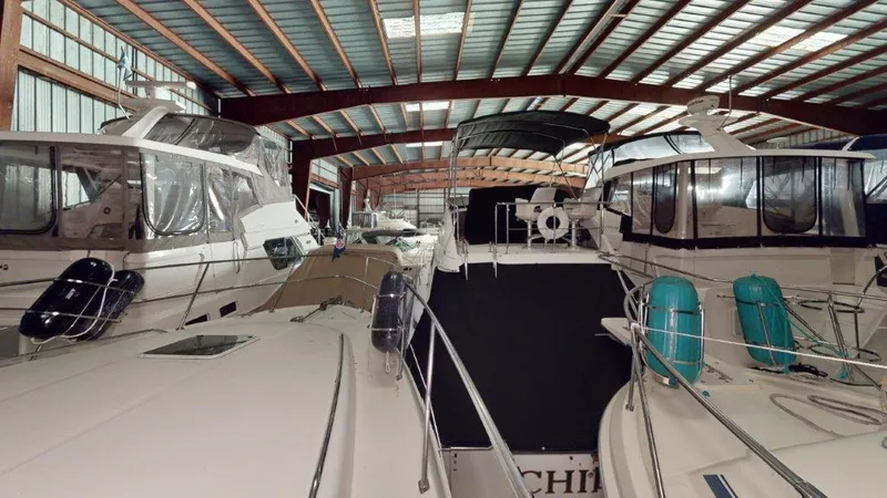 Slide: The Image of Indoor storage of Sea Ray 420 Aft Cabin yachts, 1996 model, in a spacious facility. - 11