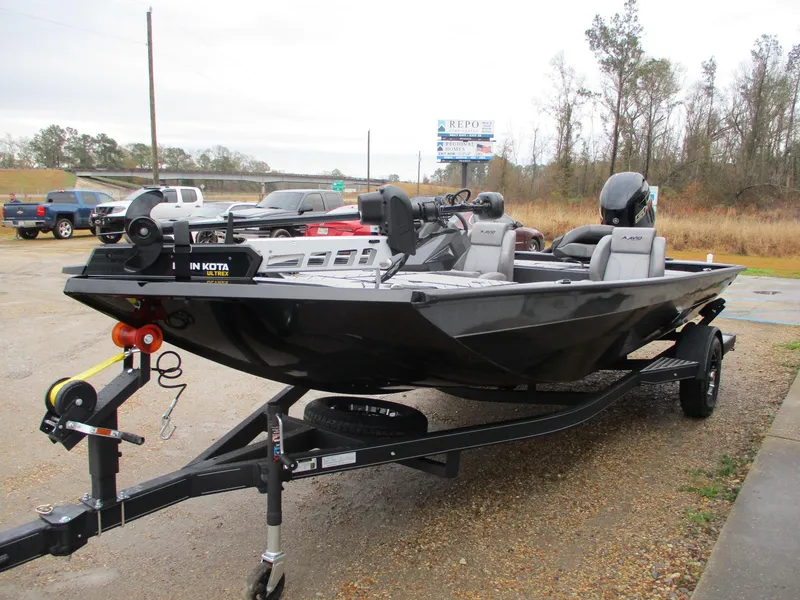 Slide: The Image of 2025 Avid 18 Vertex boat on trailer, parked outdoors. - 3
