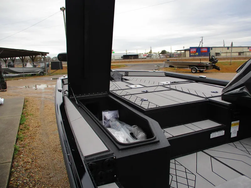 Slide: The Image of 2025 Avid 18 Vertex boat with open storage compartment, showcasing sleek design and spacious layout. - 4