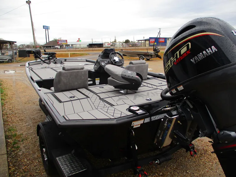 Slide: The Image of 2025 Avid 18 Vertex boat with Yamaha engine, parked outdoors. - 5