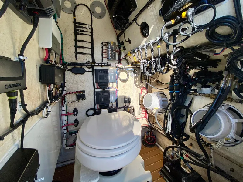Slide: The Image of 2019 Yellowfin 29 Offshore boat interior with wiring and equipment. - 21