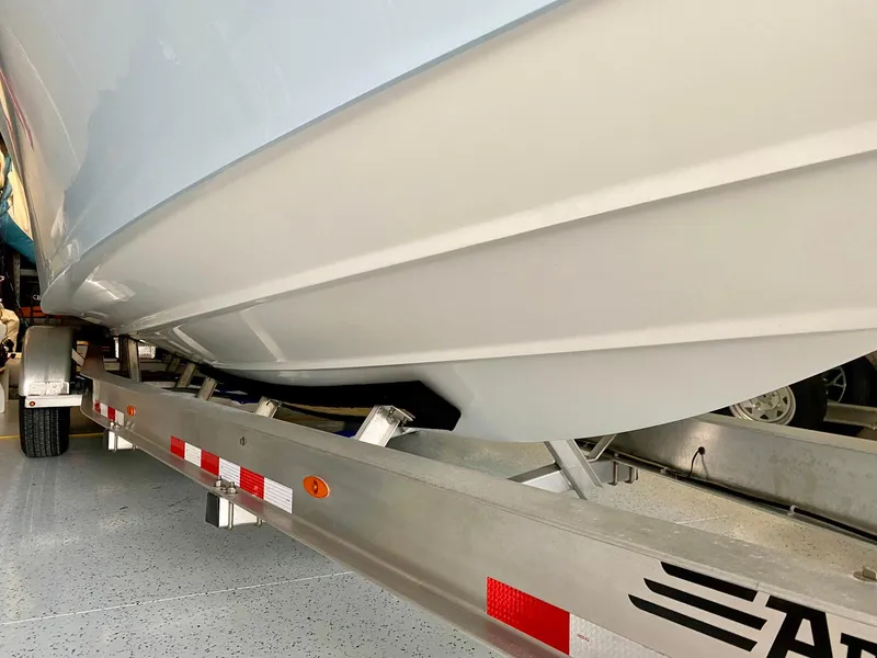 Slide: The Image of 2019 Yellowfin 29 Offshore boat on trailer, close-up view of hull. - 23