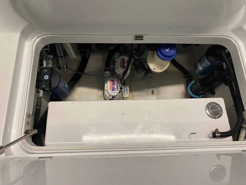 Slide: The Image of 2019 Yellowfin 29 Offshore boat engine compartment with visible components and wiring. - 29