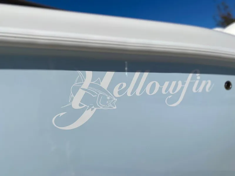 Slide: The Image of 2019 Yellowfin 29 Offshore boat logo on hull, featuring fish graphic. - 3