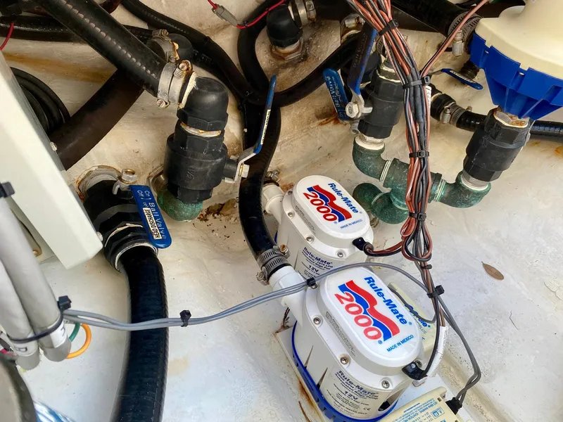 Slide: The Image of Bilge area of 2019 Yellowfin 29 Offshore with pumps and wiring. - 8