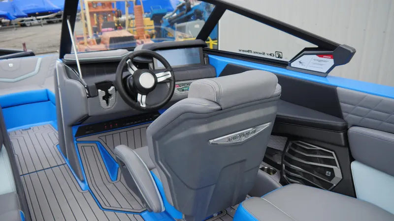 Slide: The Image of 2023 Nautique Super Air G23 interior with modern dashboard and steering wheel design. - 10