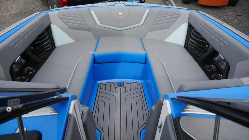 Slide: The Image of 2023 Nautique Super Air G23 boat interior with blue and gray seating and modern design. - 12