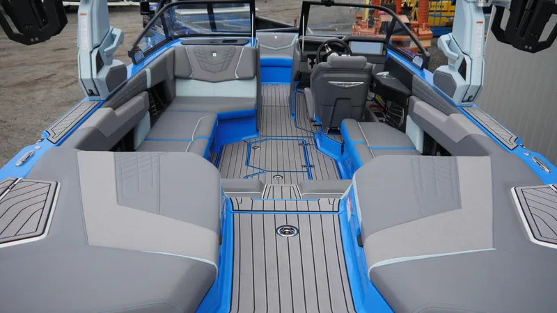 Slide: The Image of 2023 Nautique Super Air G23 interior with gray and blue seating, modern design. - 7