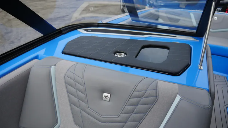 Slide: The Image of 2023 Nautique Super Air G23 interior with blue and gray upholstery, showcasing sleek design. - 9