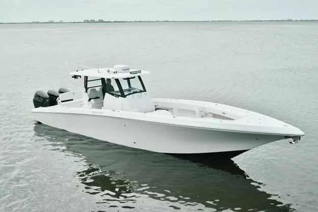 Slide: The Image of 2024 Fountain Bluewater 38 Tournament Edition boat on calm water. - 1