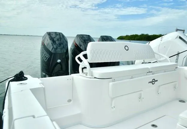 Slide: The Image of 2024 Fountain Bluewater 38 Tournament Edition boat with powerful outboard engines. - 12