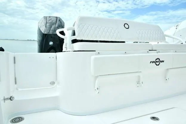 Slide: The Image of 2024 Fountain Bluewater 38 Tournament Edition boat interior with seating and engine view. - 13