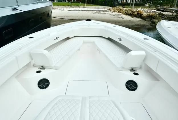 Slide: The Image of 2024 Fountain Bluewater 38 Tournament Edition boat with white seating and spacious deck. - 14