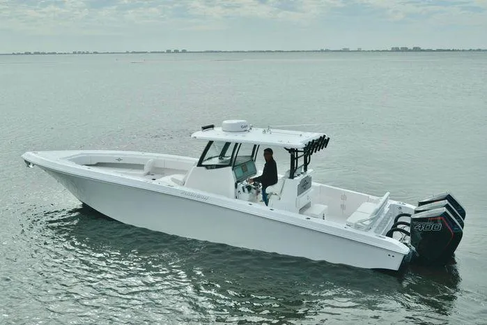 Slide: The Image of 2024 Fountain Bluewater 38 Tournament Edition boat on calm water. - 2