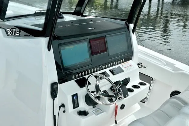 Slide: The Image of 2024 Fountain Bluewater 38 Tournament Edition boat dashboard with modern navigation screens and controls. - 3