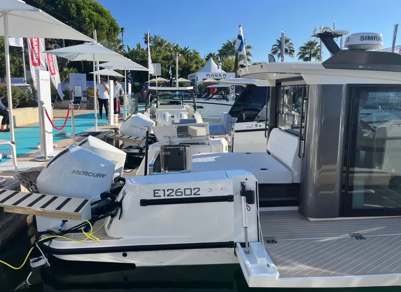Slide: The Image of 2025 Saxdor 340 GTWA boat docked at marina, showcasing sleek design and modern features. - 10