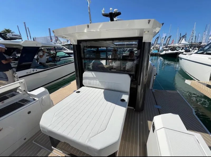 Slide: The Image of 2025 Saxdor 340 GTWA boat docked, featuring Mercury engine and modern design. - 11