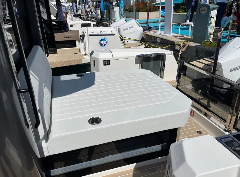 Slide: The Image of 2026 Saxdor 340 GTWA yacht docked at marina, featuring sleek deck design. - 12