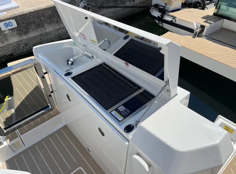 Slide: The Image of 2026 Saxdor 340 GTWA boat with twin Mercury engines at dock. - 13