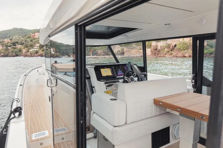 Slide: The Image of 2025 Saxdor 340 GTWA boat interior with seating and deck details. - 14