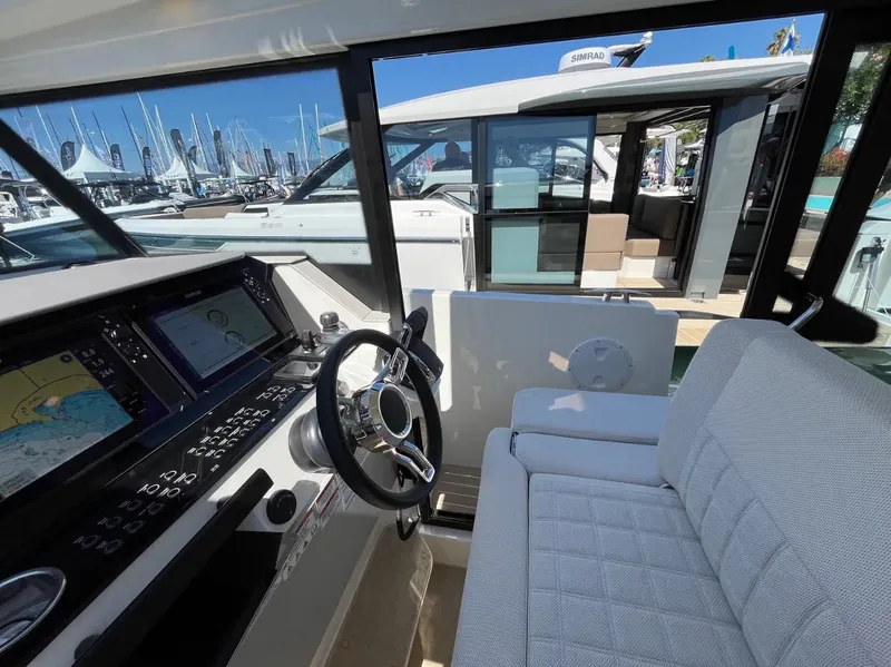 Slide: The Image of Interior view of 2025 Saxdor 340 GTWA boat cockpit with modern navigation system. - 23