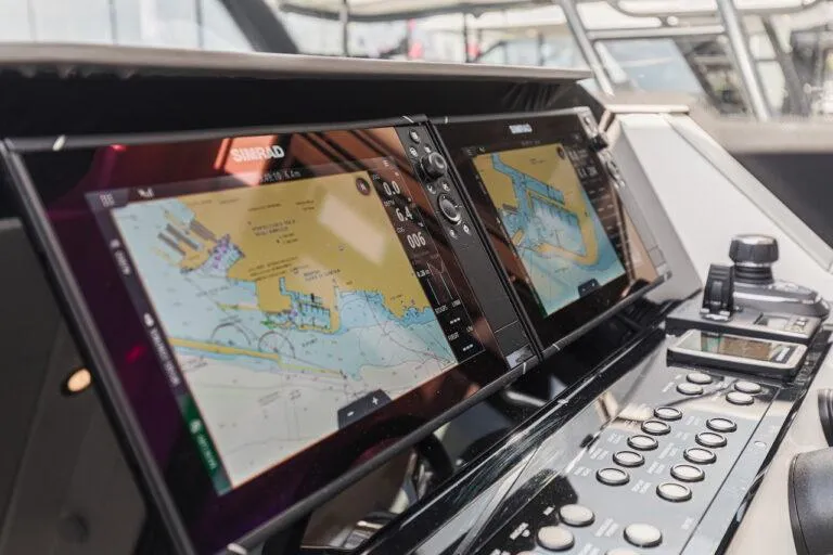 Slide: The Image of Interior of 2026 Saxdor 340 GTWA boat with white seating and wooden table. - 26