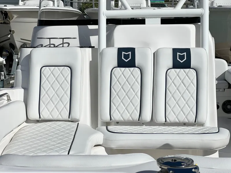 Slide: The Image of 2025 Sea Fox 248 Side Console boat with white quilted seating. - 15