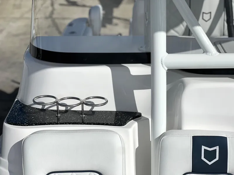 Slide: The Image of 2025 Sea Fox 248 Side Console boat interior with cup holders and sleek design. - 16