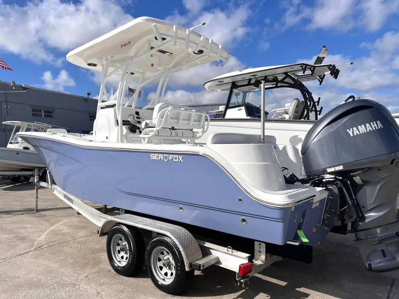 Slide: The Image of 2025 Sea Fox 248 Side Console boat with Yamaha engine on trailer. - 2