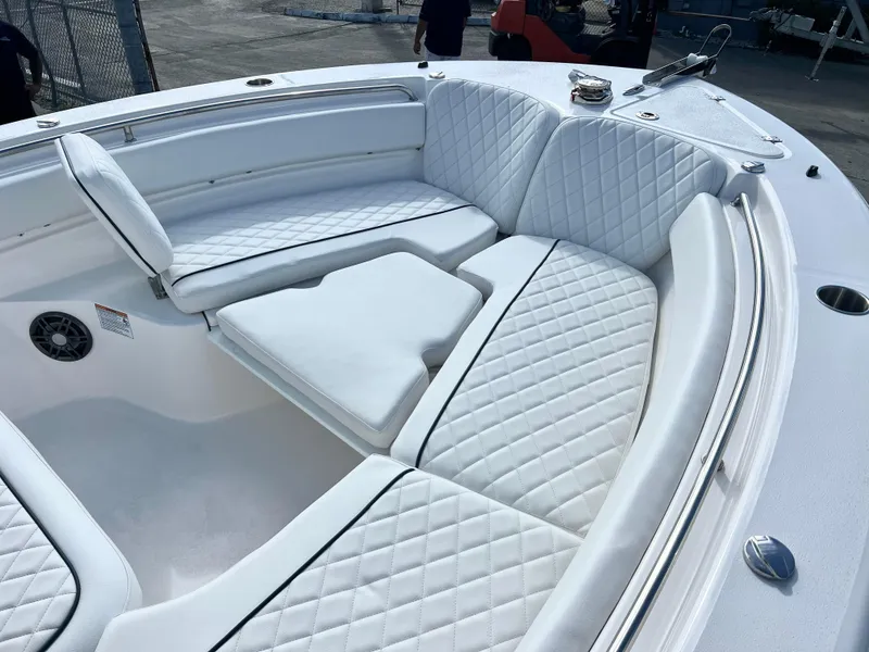 Slide: The Image of 2025 Sea Fox 248 Side Console boat with luxurious white seating and quilted upholstery. - 22