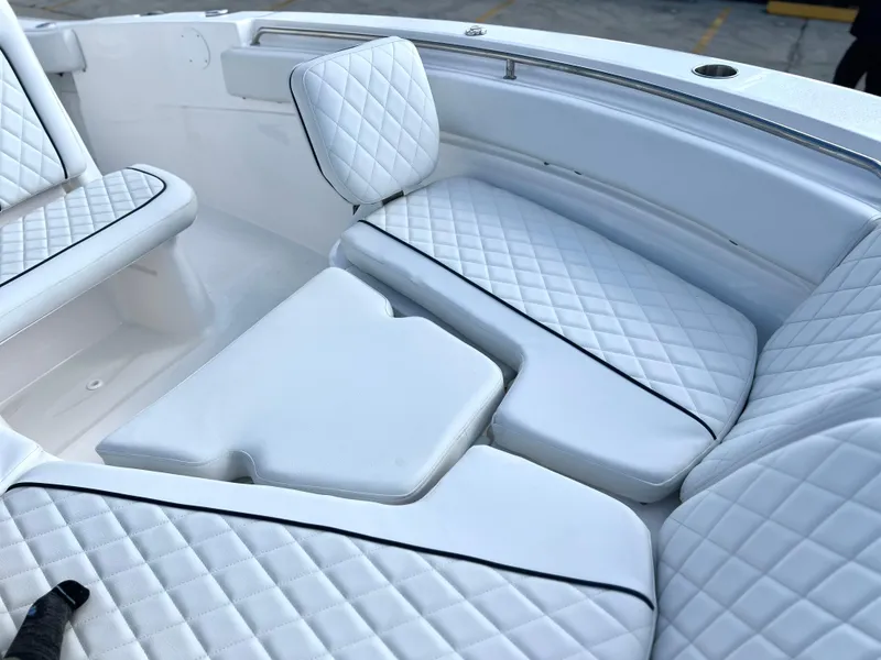 Slide: The Image of Luxurious seating on 2025 Sea Fox 248 Side Console boat with quilted white upholstery. - 23