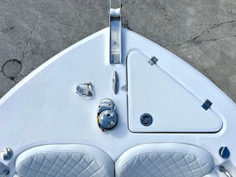 Slide: The Image of 2025 Sea Fox 248 Side Console boat bow with seating and storage compartments. - 24
