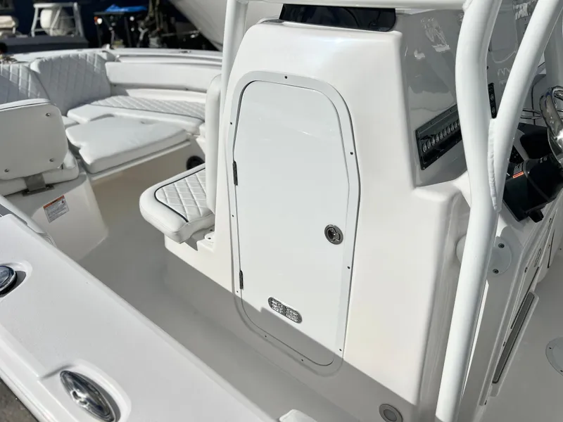 Slide: The Image of 2025 Sea Fox 248 Side Console boat interior with white seating and console. - 26