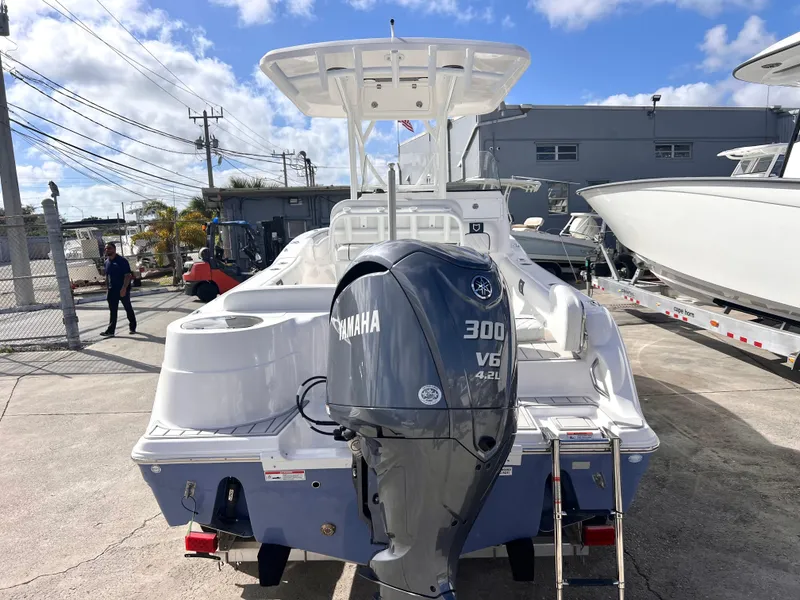 Slide: The Image of 2025 Sea Fox 248 Side Console boat with Yamaha 300 V6 engine, docked outdoors. - 3