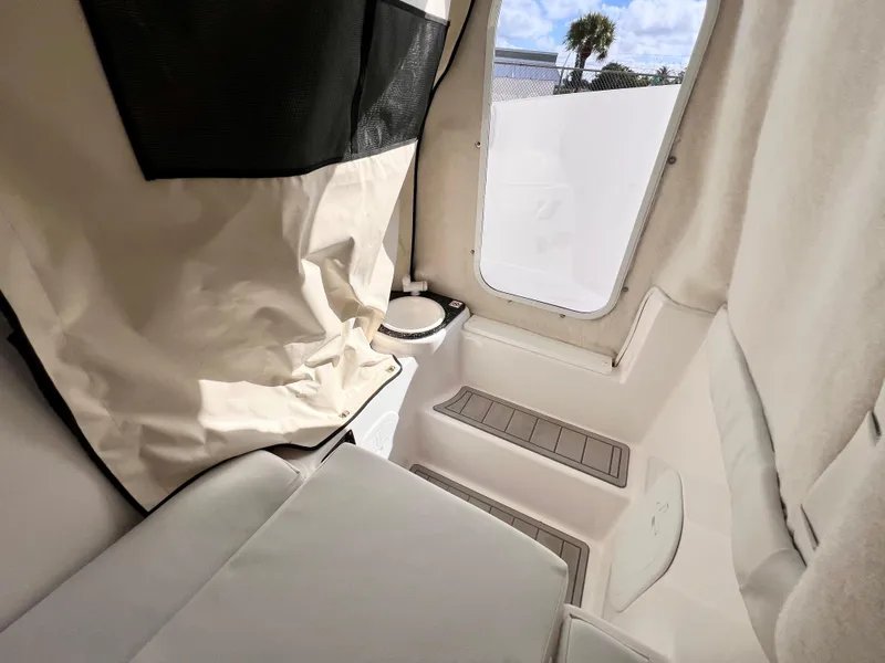 Slide: The Image of Interior of 2025 Sea Fox 248 Side Console boat with seating and window view. - 30