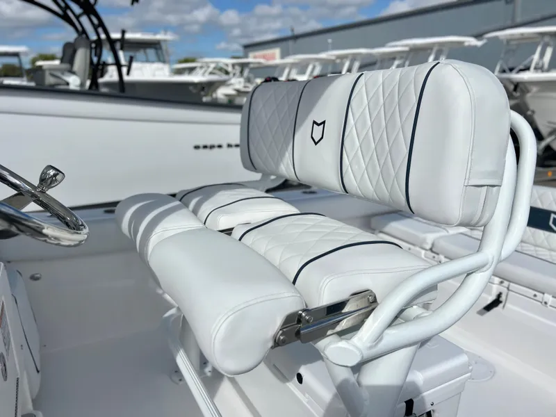 Slide: The Image of Luxurious seating on 2025 Sea Fox 248 Side Console boat, featuring white quilted upholstery. - 34