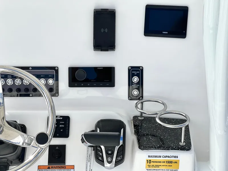 Slide: The Image of Control panel of 2025 Sea Fox 248 Side Console boat with steering wheel and electronics. - 37
